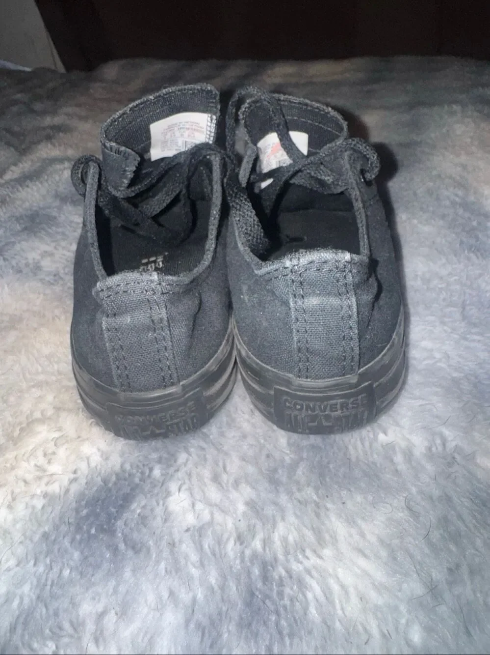 All black low top Converses size youth 3